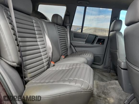 1994 Jeep Grand Cherokee Laredo z VIN 1J4GZ58S0RC221854, wystawiony jako Copart lot #61950825 z przebiegiem 69 465 mil mil oraz Czysty tytuł • Clean title. Historia ofert i sprzedaży dostępna na DreamBid. Obrazek 11.