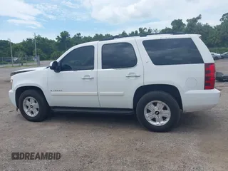 2007 Chevrolet Tahoe LTZ with VIN 1GNFC13J47J336516, listed as a IAAI auction lot 42545424 with 211,669 mi miles and . Bid and sale history available at DreamBid. Image 14.