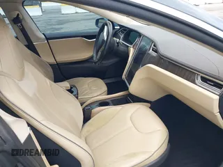 2013 Tesla Model S with VIN 5YJSA1CN8DFP21869, listed as a IAAI auction lot 41772603 with Not provided miles and . Bid and sale history available at DreamBid. Image 5.