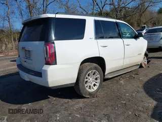 2019 GMC Yukon SLT with VIN 1GKS2BKC9KR166896, listed as a IAAI auction lot 41429865 with 165,174 mi miles. Bid and sale history available at carsss.com. Image 4.