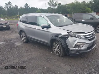 2017 Honda Pilot Touring z VIN 5FNYF5H9XHB042545, wystawiony jako IAAI lot #42413236 z przebiegiem 117 488 mil mil oraz . Historia ofert i sprzedaży dostępna na DreamBid. Obrazek 1.