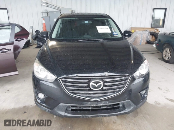 2016 Mazda CX-5 Touring with VIN JM3KE2CY2G0808424, listed as a IAAI auction lot 41880494 with 149,005 mi miles. Bid and sale history available at carsss.com. Image 12.