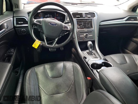 2016 Ford Fusion Titanium Hybrid with VIN 3FA6P0RUXGR204106, listed as a Copart auction lot 62769015 with 106,826 mi miles and Salvage title. Bid and sale history available at DreamBid. Image 8.