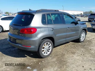 2014 Volkswagen Tiguan SE z VIN WVGAV3AX0EW511694, wystawiony jako IAAI lot #41811345 z przebiegiem 95 129 mil mil oraz . Historia ofert i sprzedaży dostępna na DreamBid. Obrazek 4.