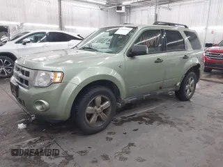 2008 Ford Escape XLT with VIN 1FMCU931X8KE68551, listed as a IAAI auction lot 41611972 with 267,034 mi miles. Bid and sale history available at carsss.com. Image 2.