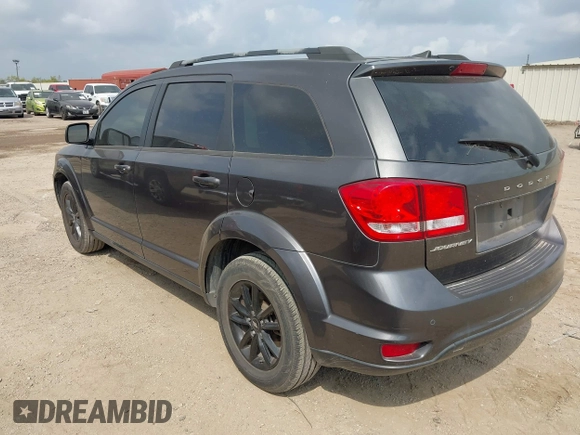 2019 Dodge Journey SE with VIN 3C4PDCBBXKT860142, listed as a IAAI auction lot 42126997 with 101,675 mi miles and . Bid and sale history available at DreamBid. Image 3.
