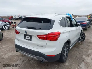 2019 BMW X1 xDrive28i with VIN WBXHT3C51K5L90392, listed as a IAAI auction lot 41571403 with 96,732 mi miles. Bid and sale history available at carsss.com. Image 4.