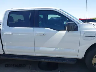 2023 Ford F-150 Lightning Pro with VIN 1FTVW1EL4PWG42578, listed as a IAAI auction lot 41992446 with 26,729 mi miles and . Bid and sale history available at DreamBid. Image 13.