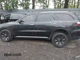 2013 Dodge Durango Crew with VIN 1C4RDJDG8DC675527, listed as a IAAI auction lot 42452197 with 184,981 mi miles and . Bid and sale history available at DreamBid. Image 14.