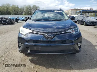 2018 Toyota RAV4 XLE with VIN JTMWFREV7JD130465, listed as a Copart auction lot 63314795 with 97,334 mi miles and Salvage title. Bid and sale history available at DreamBid. Image 5.