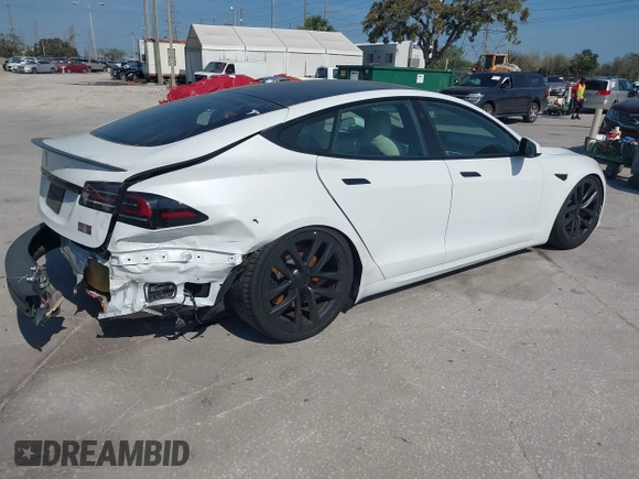 2022 Tesla Model S Plaid with VIN 5YJSA1E64NF484904, listed as a IAAI auction lot 41594464 with 25,299 mi miles and . Bid and sale history available at DreamBid. Image 4.