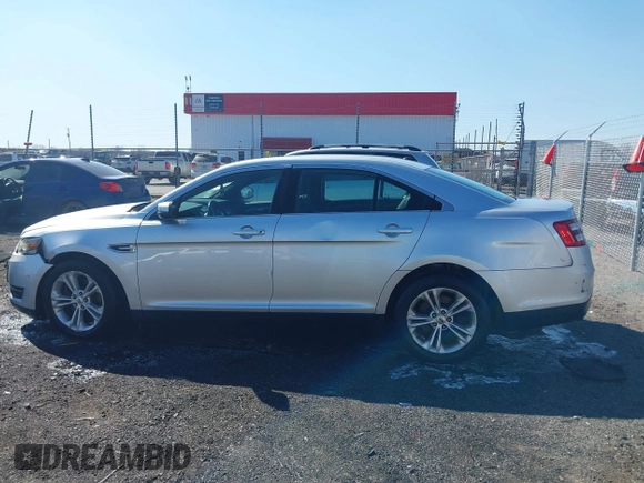 2013 Ford Taurus SEL with VIN 1FAHP2E8XDG164903, listed as a IAAI auction lot 41580690 with 163,128 mi miles and . Bid and sale history available at carsss.com. Image 14.