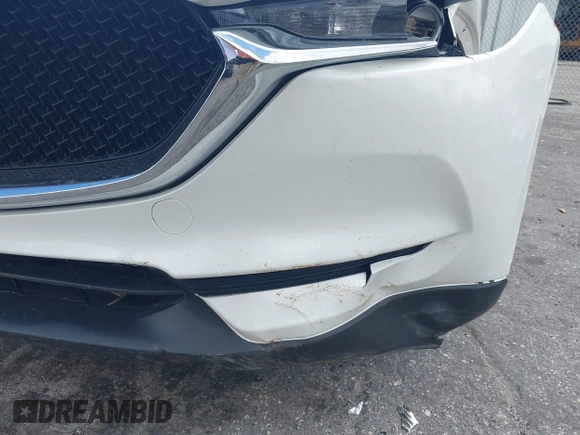 2018 Mazda CX-5 Touring z VIN JM3KFACM6J1419663, wystawiony jako IAAI lot #41879677 z przebiegiem 115 224 mil mil oraz . Historia ofert i sprzedaży dostępna na DreamBid. Obrazek 18.