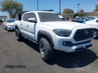 2023 Toyota Tacoma SR with VIN 3TMCZ5AN4PM558760, listed as a IAAI auction lot 42626514 with 39,335 mi miles and . Bid and sale history available at DreamBid. Image 13.