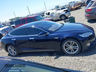 2014 Tesla Model S 60 with VIN 5YJSA1H18EFP31969, listed as a IAAI auction lot 42312485 with 90,043 mi miles and . Bid and sale history available at DreamBid. Image 14.