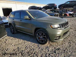 2021 Jeep Grand Cherokee SRT with VIN 1C4RJFDJ5MC718125, listed as a Copart auction lot 88736945 with 54,553 mi miles and Salvage Title. Bid and sale history available at carsss.com. Image 4.
