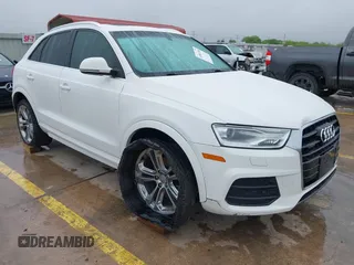 2016 Audi Q3 Premium Plus z VIN WA1EFCFS7GR007879, wystawiony jako IAAI lot #41861100 z przebiegiem 99 338 mil mil oraz . Historia ofert i sprzedaży dostępna na DreamBid. Obrazek 1.