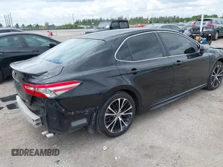 2018 Toyota Camry LE z VIN 4T1B11HK6JU158382, wystawiony jako IAAI lot #42185532 z przebiegiem 94 802 mil mil oraz . Historia ofert i sprzedaży dostępna na DreamBid. Obrazek 4.
