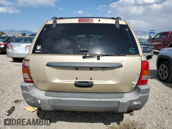 2000 Jeep Grand Cherokee Laredo with VIN 1J4GW48S6YC304447, listed as a Copart auction lot 58001035 with Not provided miles and Clean title. Bid and sale history available at DreamBid. Image 6.