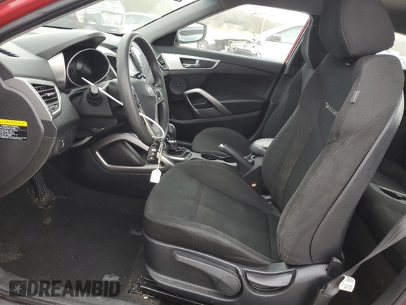 2016 Hyundai Veloster z VIN KMHTC6AD9GU302135, wystawiony jako Copart lot #81881264 z przebiegiem 167 281 mil mil oraz Szkoda całkowita • Salvage title. Historia ofert i sprzedaży dostępna na DreamBid. Obrazek 7.