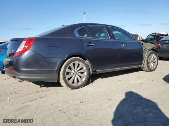 2014 Lincoln MKS with VIN 1LNHL9DK8EG604464, listed as a Copart auction lot 82766134 with 124,591 mi miles and Salvage Title. Bid and sale history available at carsss.com. Image 3.