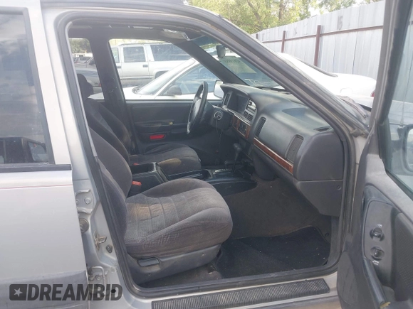 1998 Jeep Grand Cherokee Laredo with VIN 1J4GZ58S6WC319265, listed as a IAAI auction lot 42619853 with 238,667 mi miles and . Bid and sale history available at DreamBid. Image 5.