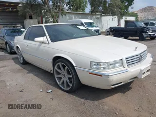 2002 Cadillac Eldorado ESC z VIN 1G6EL12Y92B100484, wystawiony jako IAAI lot #42418094 z przebiegiem 167 293 mil mil oraz . Historia ofert i sprzedaży dostępna na DreamBid. Obrazek 1.