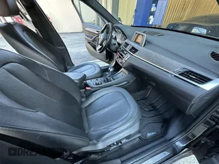 2017 BMW X1 xDrive28i with VIN WBXHT3C32H5F67896, listed as a IAAI auction lot 41823288 with 80,130 mi miles. Bid and sale history available at carsss.com. Image 5.