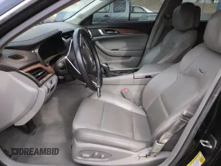 2014 Cadillac CTS RWD z VIN 1G6AP5SX6E0193868, wystawiony jako Copart lot #51795485 z przebiegiem 100 039 mil mil oraz Szkoda całkowita • Salvage title. Historia ofert i sprzedaży dostępna na DreamBid. Obrazek 7.
