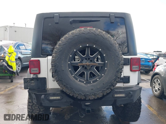 2014 Jeep Wrangler Unlimited Rubicon with VIN 1C4BJWFG2EL264792, listed as a IAAI auction lot 40938380 with 145,886 mi miles. Bid and sale history available at carsss.com. Image 17.