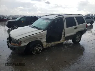 2004 Jeep Grand Cherokee Laredo z VIN 1J4GW48S74C165732, wystawiony jako Copart lot #56316885 z przebiegiem 177 139 mil mil oraz Szkoda całkowita • Salvage title. Historia ofert i sprzedaży dostępna na DreamBid. Obrazek 1.
