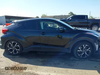 2020 Toyota C-HR LE with VIN JTNKHMBX9L1063563, listed as a IAAI auction lot 41986457 with 143,694 mi miles. Bid and sale history available at carsss.com. Image 14.