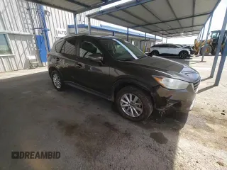 2016 Mazda CX-5 Touring z VIN JM3KE2CY4G0805072, wystawiony jako Copart lot #58435535 z przebiegiem 146 323 mil mil oraz Szkoda całkowita • Salvage title. Historia ofert i sprzedaży dostępna na DreamBid. Obrazek 13.