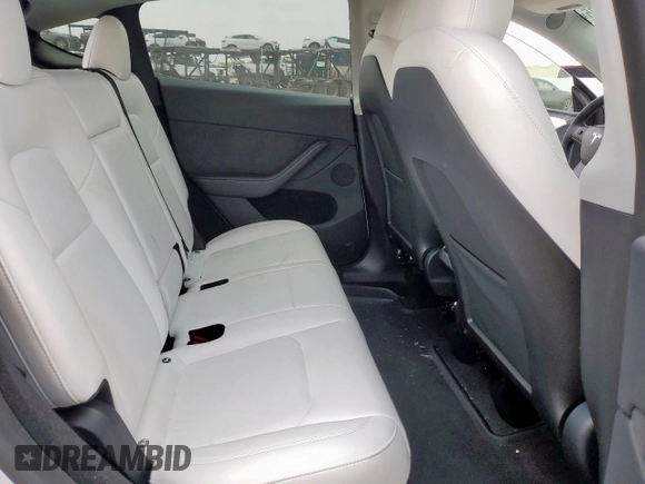 2024 Tesla Model Y Long Range with VIN 7SAYGDEE6RA290124, listed as a Copart auction lot 57662385 with 14,751 mi miles and Salvage title. Bid and sale history available at DreamBid. Image 10.
