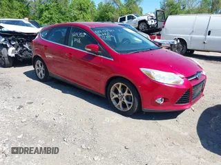 2012 Ford Focus SEL with VIN 1FAHP3M22CL335913, listed as a IAAI auction lot 42143922 with 129,421 mi miles. Bid and sale history available at carsss.com. Image 1.