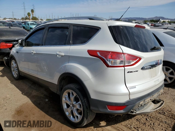 2016 Ford Escape Titanium with VIN 1FMCU9J91GUA11090, listed as a Copart auction lot 54231675 with 135,735 mi miles and Salvage Title. Bid and sale history available at DreamBid. Image 2.