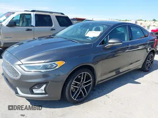2019 Ford Fusion Titanium with VIN 3FA6P0D91KR104827, listed as a IAAI auction lot 42221526 with 141,316 mi miles and . Bid and sale history available at DreamBid. Image 18.