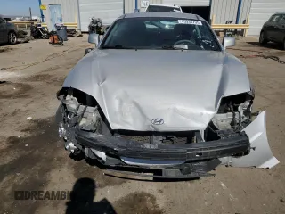 2006 Hyundai Tiburon GT z VIN KMHHN65F76U190851, wystawiony jako Copart lot #45935795 z przebiegiem 102 335 mil mil oraz Szkoda całkowita • Salvage title. Historia ofert i sprzedaży dostępna na DreamBid. Obrazek 5.