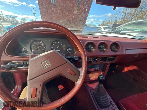 1980 Datsun 280ZX z VIN HS130198111, wystawiony jako Copart lot #84153084 z przebiegiem 106 400 mil mil oraz Tytuł czysty. Historia ofert i sprzedaży dostępna na DreamBid. Obrazek 9.