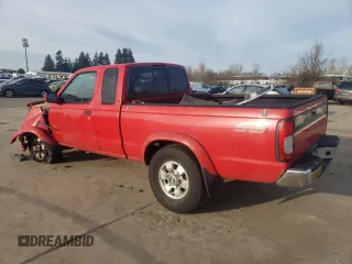 1999 Nissan Frontier XE with VIN 1N6ED26Y2XC312863, listed as a Copart auction lot 42259015 with 212,666 mi miles and Salvage title. Bid and sale history available at DreamBid. Image 2.