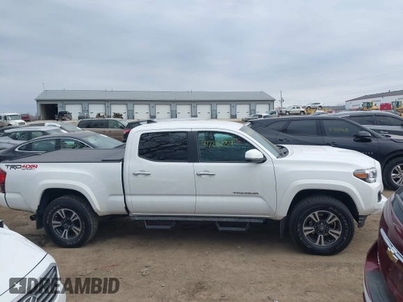 2018 Toyota Tacoma SR5 with VIN 3TMDZ5BN9JM051105, listed as a IAAI auction lot 41708034 with 98,000 mi miles and . Bid and sale history available at DreamBid. Image 13.