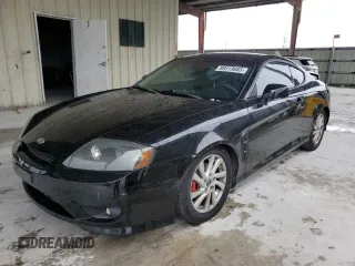 2005 Hyundai Tiburon GT z VIN KMHHN65F55U175179, wystawiony jako Copart lot #89319685 z przebiegiem 220 117 mil mil oraz Tytuł czysty. Historia ofert i sprzedaży dostępna na DreamBid. Obrazek 1.
