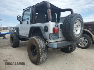 2003 Jeep Wrangler Rubicon z VIN 1J4FA69S53P340085, wystawiony jako Copart lot #74564574 z przebiegiem Nie podano mil oraz Szkoda całkowita • Salvage title. Historia ofert i sprzedaży dostępna na DreamBid. Obrazek 2.