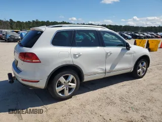2014 Volkswagen Touareg Lux z VIN WVGEF9BP4ED011436, wystawiony jako Copart lot #74207144 z przebiegiem 207 059 mil mil oraz Szkoda całkowita • Salvage title. Historia ofert i sprzedaży dostępna na DreamBid. Obrazek 3.