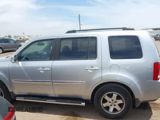 2011 Honda Pilot Touring z VIN 5FNYF3H90BB006634, wystawiony jako IAAI lot #42388390 z przebiegiem 218 475 mil mil oraz . Historia ofert i sprzedaży dostępna na DreamBid. Obrazek 14.