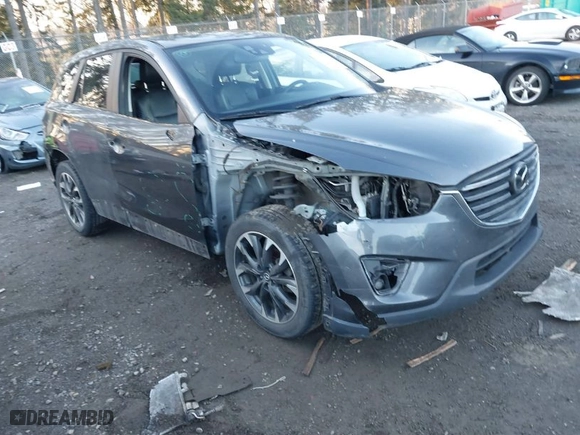 2016 Mazda CX-5 Grand Touring with VIN JM3KE4DY3G0817899, listed as a IAAI auction lot 41287459 with NaN miles. Bid and sale history available at carsss.com. Image 6.