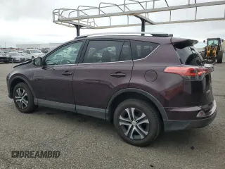2016 Toyota RAV4 LE with VIN 2T3BFREV3GW490181, listed as a Copart auction lot 52457435 with 128,267 mi miles and Salvage Title. Bid and sale history available at DreamBid. Image 2.
