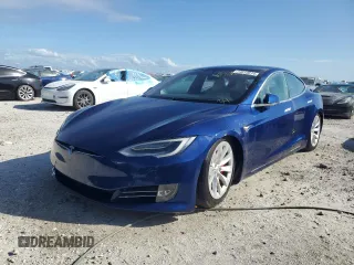 2019 Tesla Model S 100D z VIN 5YJSA1E41KF332086, wystawiony jako Copart lot #74513814 z przebiegiem Nie podano mil oraz Szkoda całkowita • Salvage title. Historia ofert i sprzedaży dostępna na DreamBid. Obrazek 1.