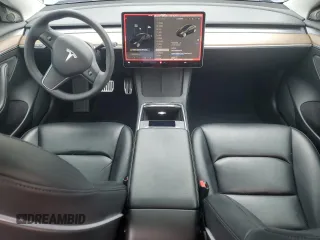 2022 Tesla Model 3 Long Range with VIN 5YJ3E1EB9NF117339, listed as a Copart auction lot 55659415 with 87,479 mi miles and Salvage Title. Bid and sale history available at DreamBid. Image 8.