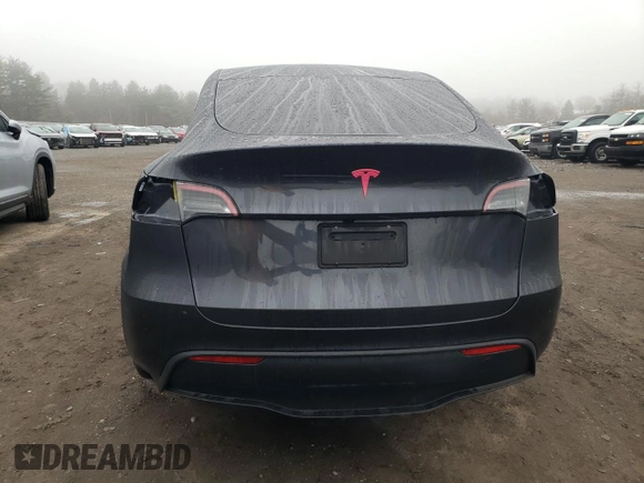2025 Tesla Model Y Long Range z VIN 7SAYGDED9SF269767, wystawiony jako Copart lot #51588985 z przebiegiem 1 943 mil mil oraz Szkoda całkowita • Salvage title. Historia ofert i sprzedaży dostępna na DreamBid. Obrazek 6.